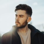man in black zip up jacket